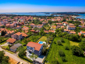 Luxury villa Medulin with pool near the beach , sea view, extra pool heating available